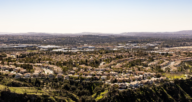 An aerial view of a city in California where houses are bought by We Buy Houses companies.